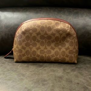 NWOT Coach cosmetic bag! Beautiful and sturdy bag. No flaws, has not been used.